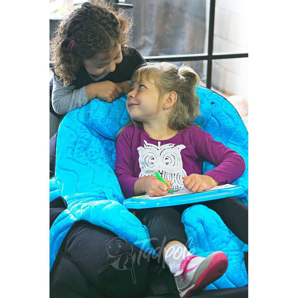 Sisters engaging and looking at each other in P Pod Postural Support System by Inspired by Drive