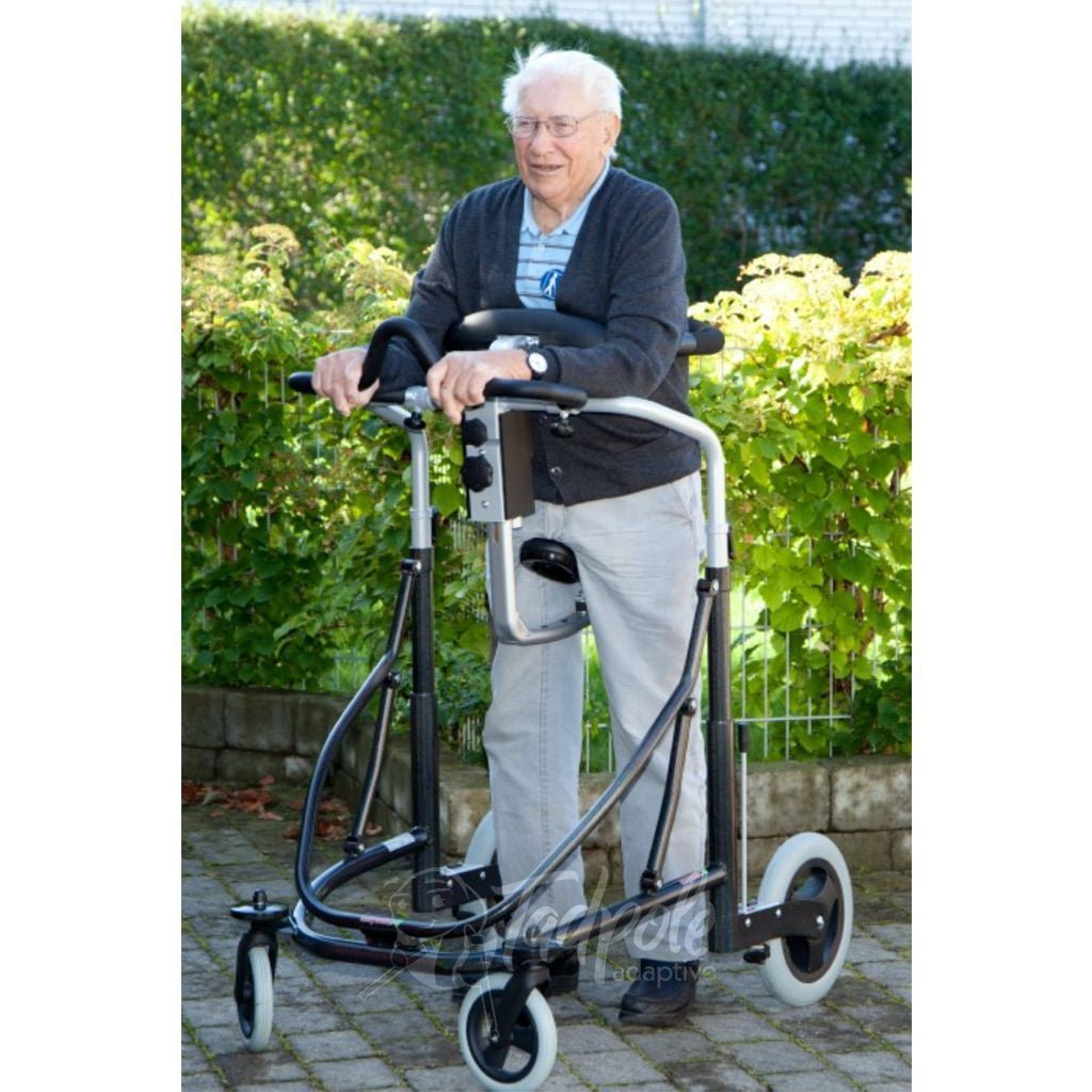 Older gentleman in his Pacific Rehab Meyland Smith Meywalk MK4 Gait Trainer, largest size.