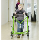 Meywalk Young boy with green Meywalk 2000 Gait Trainer By Pacific Rehab walking down hallway.