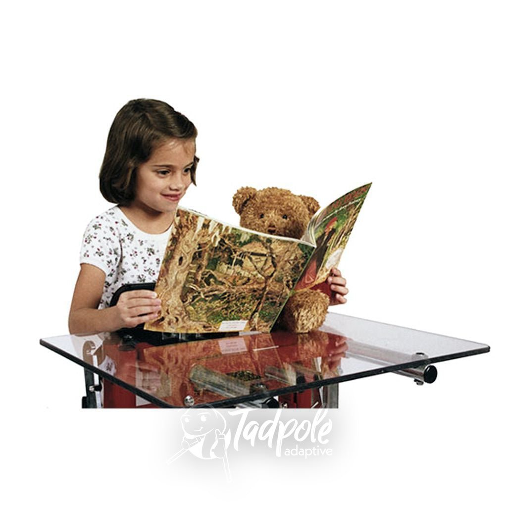 Little girl standing and reading using tray in her Prime Engineering Kidstand III.