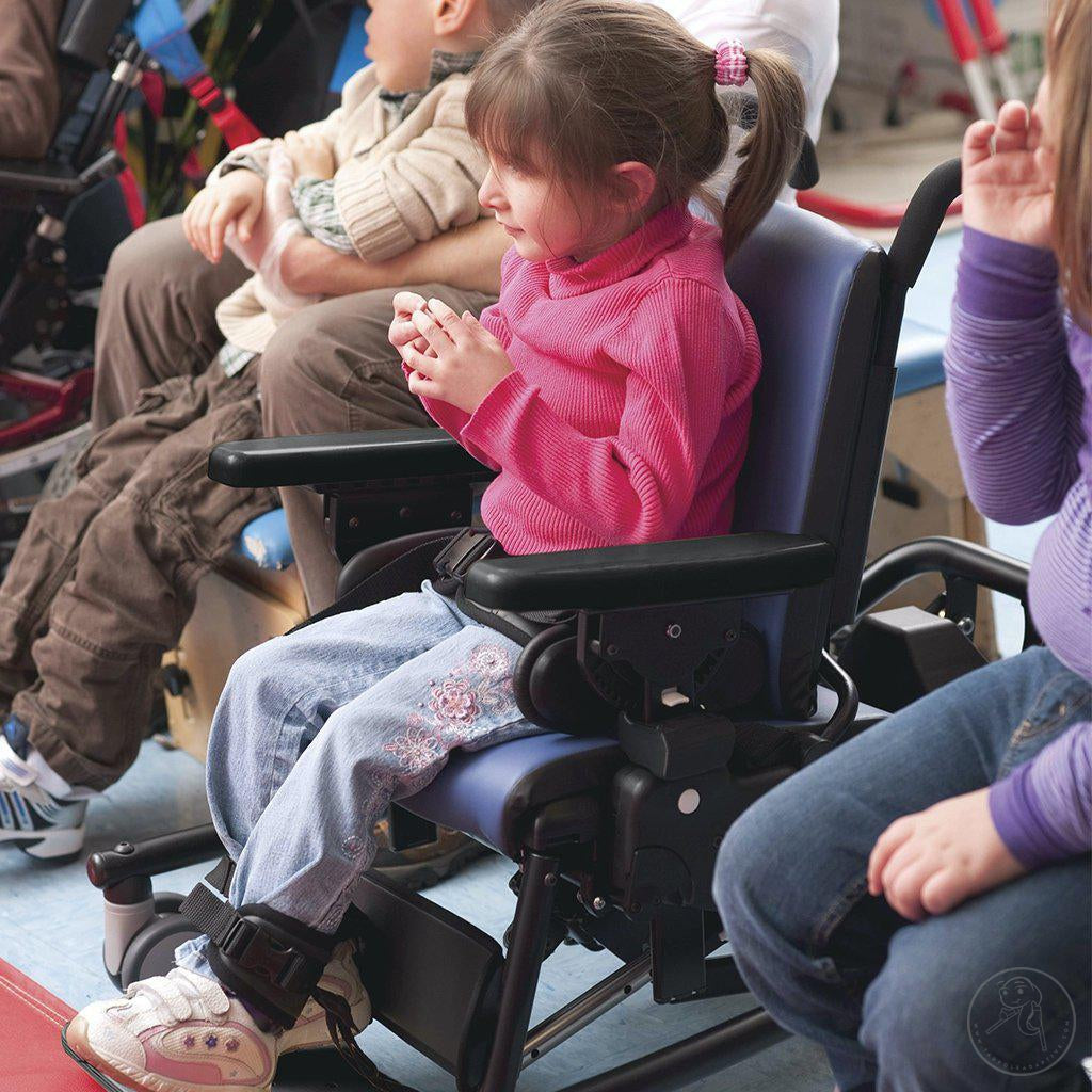 Little girl enjoying a performance in her Rifton Activity Chair with Hi-Low Base.