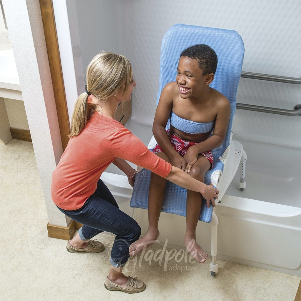Kiddo using Rifton Wave Tub Transfer Base with helper.