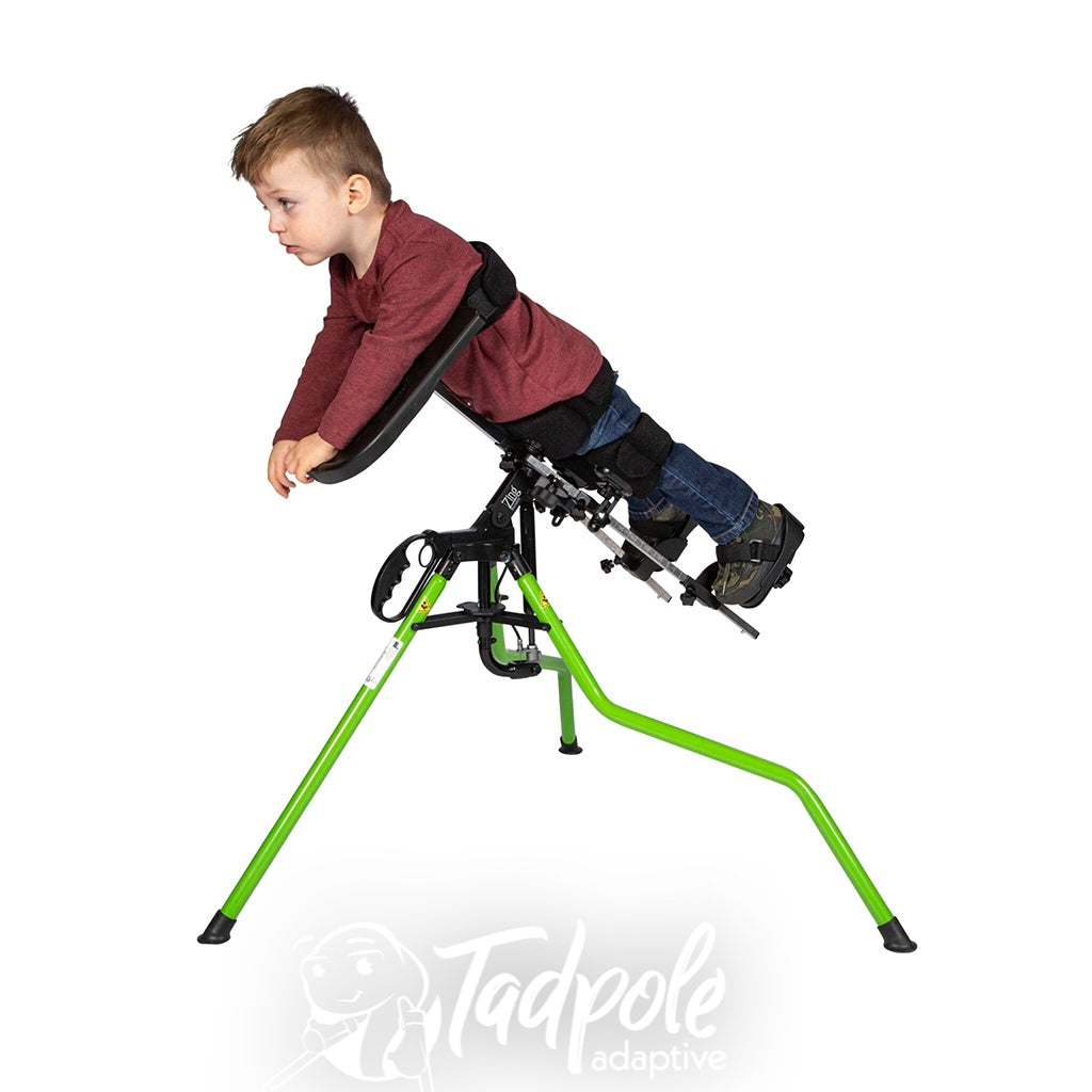 Boy standing prone in Easystand Zing Portable with Tray.