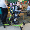 of EasyStand Zing MPS Size 1, Kiddo is being moved across classroom by the teacher.