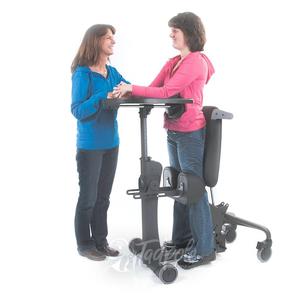 EasyStand Evolv E3 Large, Bonnie standing with therapist 