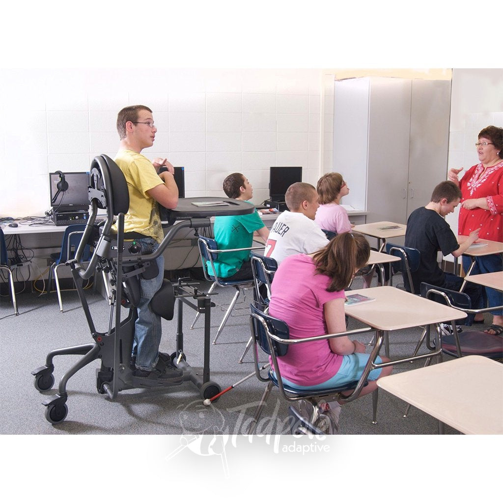 Young man in EasyStand Evolv Medium, in the classroom.