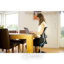 Young girl at table using laptop using her Krabat Jockey Lite.