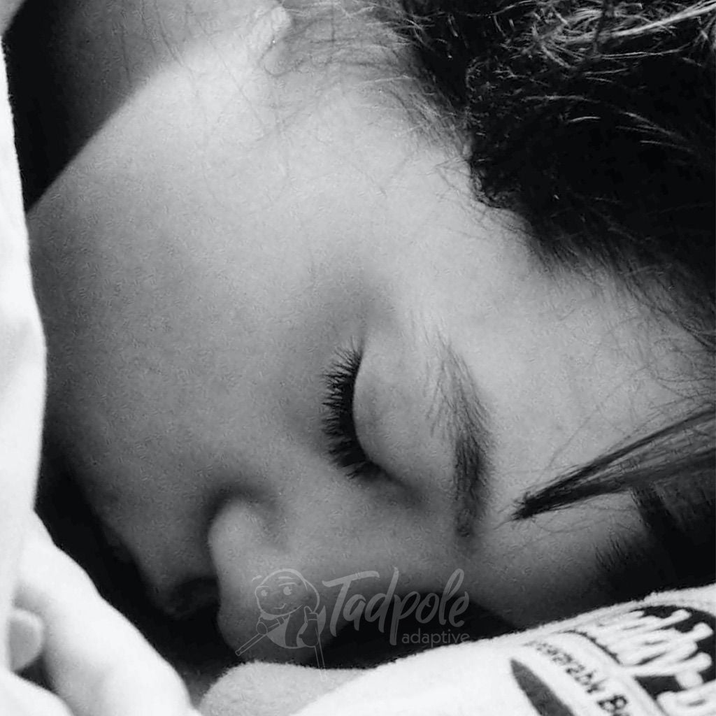 A different kiddo asleep in his Leckey Sleepform.