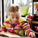 Leckey Squiggles Seating System Little girl reading at the table