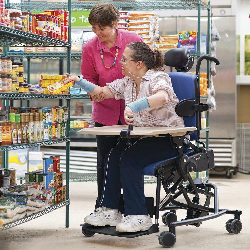 Older woman shopping in her Large Activity Chair with Hi-Low Base.