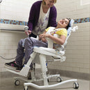Medium Rifton HTS on Mobile Tilt-in-Space Base with Footboard in shower.