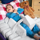 Young boy, on back in an adjustable bed using the Jenx Dreama - Postural Support Sleeping System.