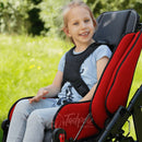 Little girl smiling and secure wearing positioning vest in her Thomashilfen EASyS Advantage.